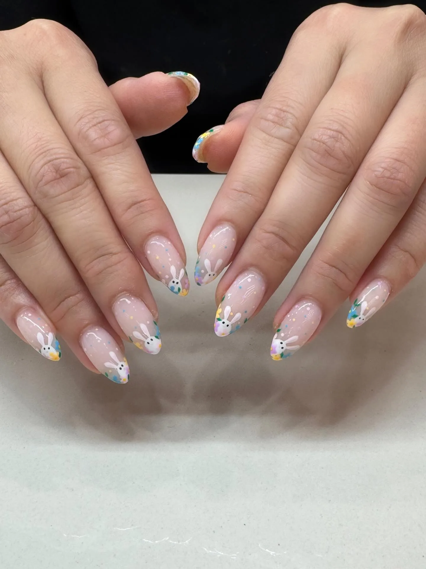 Nude French tips with Easter bunny and pastel floral art on white