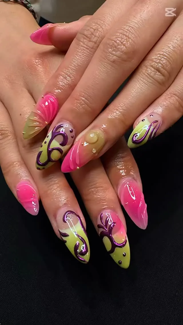 Pink and lime swirl almond nails with purple line art on black